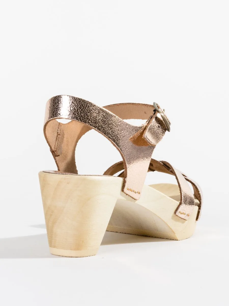 strappy old metal clog