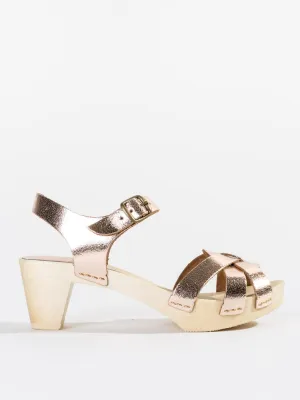 strappy old metal clog