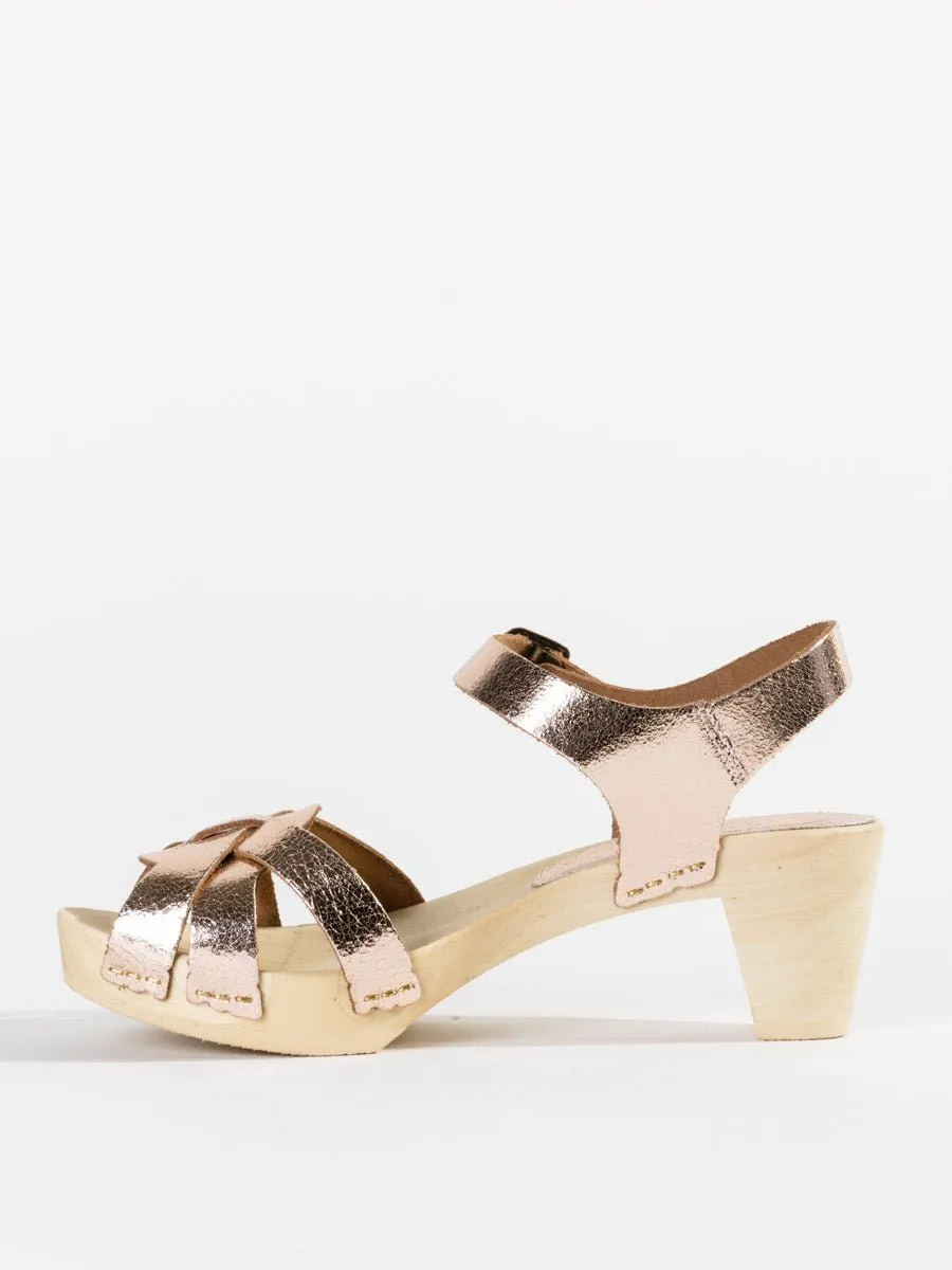 strappy old metal clog